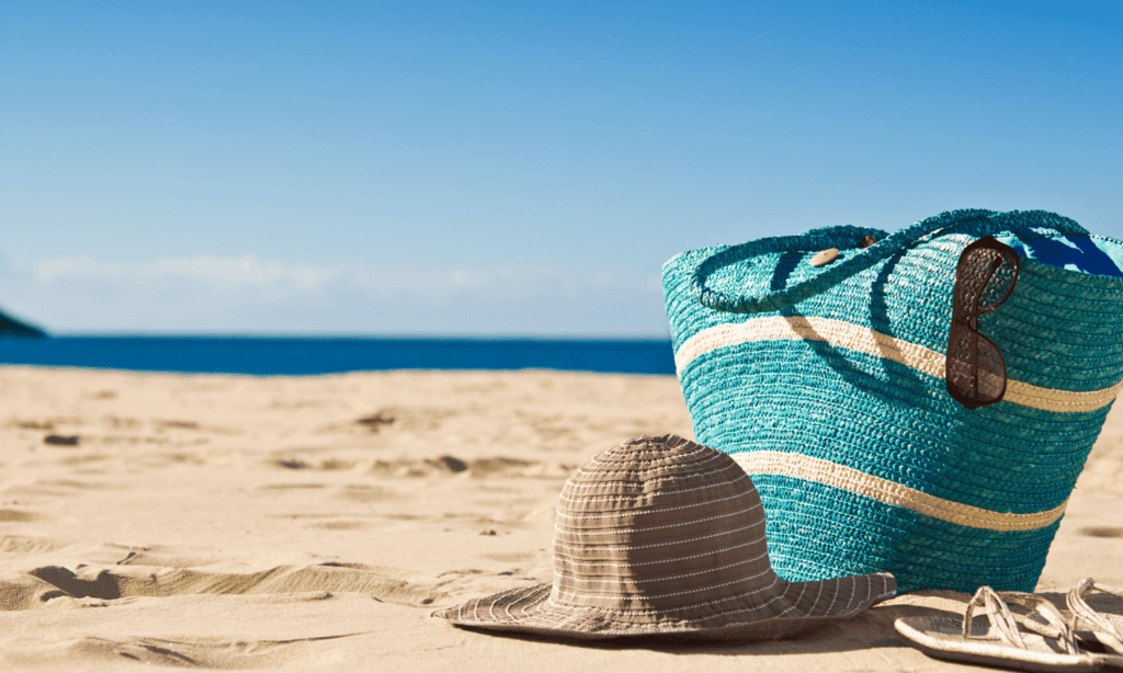 Holiday pay for workers with irregular hours and part-year workers- hat and back on the beach